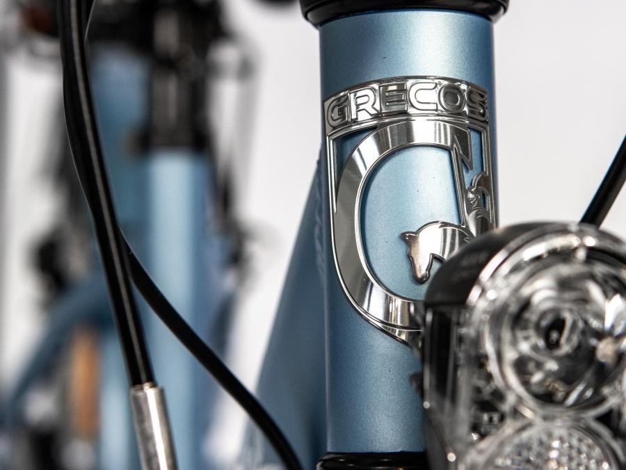 Grecos Steuerkopfemblem